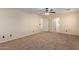 Bedroom with carpet, ceiling fan, and access to bathroom at 6321 S Teresa Dr, Chandler, AZ 85249