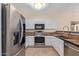 Kitchen with stainless steel appliances and a tile backsplash at 6321 S Teresa Dr, Chandler, AZ 85249