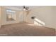 Spacious living room with neutral carpeting and high ceilings at 6321 S Teresa Dr, Chandler, AZ 85249