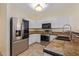 Updated kitchen featuring stainless steel appliances and tile flooring at 6321 S Teresa Dr, Chandler, AZ 85249