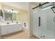 Bathroom with double vanity, bathtub, and glass shower at 6321 S Teresa Dr, Chandler, AZ 85249