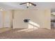 Living room with neutral carpeting and stairs to upper level at 6321 S Teresa Dr, Chandler, AZ 85249