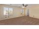 Bright bedroom with carpet flooring and ceiling fan at 6321 S Teresa Dr, Chandler, AZ 85249