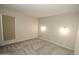 Bright bedroom with window coverings and carpet flooring at 3119 W Cochise Dr # 106, Phoenix, AZ 85051
