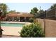 Community pool with lounge chairs and covered patio area at 3119 W Cochise Dr # 106, Phoenix, AZ 85051