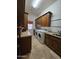 Laundry room with ample cabinet space and washer/dryer hookups at 7801 E Davenport Dr, Scottsdale, AZ 85260