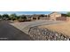 Long driveway leading to a large home with double gates at 7801 E Davenport Dr, Scottsdale, AZ 85260