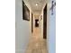 Bright hallway with tile flooring and access to bedrooms at 7801 E Davenport Dr, Scottsdale, AZ 85260