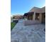 Outdoor kitchen and patio area adjacent to a pool at 7801 E Davenport Dr, Scottsdale, AZ 85260