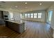 Spacious kitchen with island, modern appliances, and ample natural light at 3812 W Antelope Way, San Tan Valley, AZ 85144