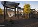 Community covered swing area with landscaping at 3812 W Antelope Way, San Tan Valley, AZ 85144