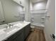 Bathroom with double vanity, bathtub, and updated flooring at 3812 W Antelope Way, San Tan Valley, AZ 85144
