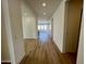 Bright hallway with wood-look flooring leading to other rooms at 3812 W Antelope Way, San Tan Valley, AZ 85144