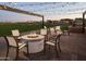 Outdoor fire pit area with comfortable seating and string lights at 3812 W Antelope Way, San Tan Valley, AZ 85144