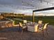 Community patio with fire pit, string lights, and seating at 3812 W Antelope Way, San Tan Valley, AZ 85144