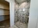 Large walk-in shower with marble tile and glass enclosure at 3812 W Antelope Way, San Tan Valley, AZ 85144