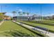 Well-maintained bocce ball courts with shaded seating areas at 10065 E Thatcher Ave, Mesa, AZ 85212
