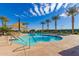 Inviting community pool with palm trees at 10065 E Thatcher Ave, Mesa, AZ 85212