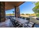 Spacious patio with large table and chairs, perfect for outdoor dining at 10065 E Thatcher Ave, Mesa, AZ 85212