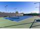 Well-lit tennis court with ample space at 10065 E Thatcher Ave, Mesa, AZ 85212