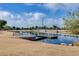 Community lake with a wooden dock and bridge at 1108 E Rojo Way, Gilbert, AZ 85297