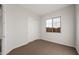 Spacious bedroom with neutral carpeting and large window at 22466 E San Tan Blvd, Queen Creek, AZ 85142