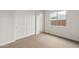 Bright bedroom with double-door closet and window at 22466 E San Tan Blvd, Queen Creek, AZ 85142