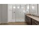 Large walk-in shower with textured tile and frameless glass at 22466 E San Tan Blvd, Queen Creek, AZ 85142