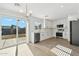 Modern kitchen with stainless steel appliances and sliding door to patio at 3121 W Libby St, Phoenix, AZ 85053