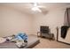 Cozy bedroom with ceiling fan, TV, and ample closet space at 3840 N 43Rd Ave # 58, Phoenix, AZ 85031