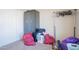 Bedroom with dark wardrobe and laundry hamper at 3840 N 43Rd Ave # 58, Phoenix, AZ 85031