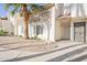 Front view of condo building with walkway and palm trees at 3840 N 43Rd Ave # 58, Phoenix, AZ 85031