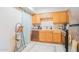 Bright kitchen with wood cabinets and tiled flooring at 3840 N 43Rd Ave # 58, Phoenix, AZ 85031