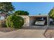 Front view of manufactured home with carport and landscaping at 5546 E Player Pl, Mesa, AZ 85215