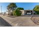 Single-wide manufactured home with carport and landscaped front yard at 5546 E Player Pl, Mesa, AZ 85215