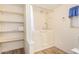 Bathroom featuring walk-in shower and shelving at 5546 E Player Pl, Mesa, AZ 85215
