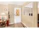 Front entry with wood-paneled walls and a decorative door at 5546 E Player Pl, Mesa, AZ 85215