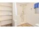 Bathroom featuring walk-in shower and shelving at 5546 E Player Pl, Mesa, AZ 85215