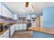 Updated kitchen featuring light blue cabinets and wood countertops at 5546 E Player Pl, Mesa, AZ 85215