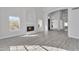 Spacious living room with hardwood floors and a fireplace at 2120 N 125Th Ave, Avondale, AZ 85392
