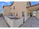 House exterior showcasing a side yard with block wall and patio at 2120 N 125Th Ave, Avondale, AZ 85392