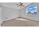 Bright bedroom with arched window and ceiling fan at 2120 N 125Th Ave, Avondale, AZ 85392