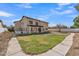Two-story house with a large backyard, grassy lawn and a walkway at 2120 N 125Th Ave, Avondale, AZ 85392