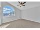 Bedroom with arched window and ceiling fan at 2120 N 125Th Ave, Avondale, AZ 85392