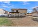 Two-story house with large backyard, grassy lawn, and walkway at 2120 N 125Th Ave, Avondale, AZ 85392