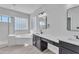 Elegant bathroom with double vanity, soaking tub, and separate shower at 2120 N 125Th Ave, Avondale, AZ 85392