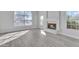 Living room with hardwood floors, fireplace and large window at 2120 N 125Th Ave, Avondale, AZ 85392