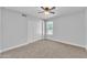 Bright bedroom with ceiling fan and double door closet at 2120 N 125Th Ave, Avondale, AZ 85392