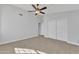 Bedroom with ceiling fan and double door closet at 2120 N 125Th Ave, Avondale, AZ 85392