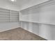 Spacious walk-in closet with ample shelving and hanging space at 2120 N 125Th Ave, Avondale, AZ 85392
